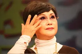 2000年，李谷一怒揭东方歌舞团腐败内幕，转身遭死亡威胁：枪毙你图片