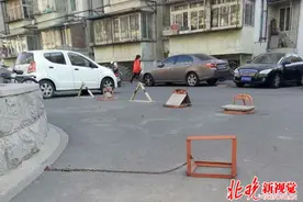 私装地锁问题引全国政协委员注意 受晚报启发难题或将解决图片