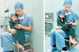 手术前小朋友哭闹不止，医师果断伸出双手——图片