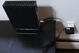 智能插座自动重启家中的路由器   网速更快图片