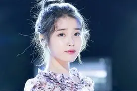 IU 一个在舞台上闪闪发光的女孩图片