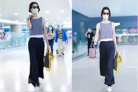 她是“冷艳超模”杜鹃，穿露脐无袖衫配阔腿裤，9头身比例好惊艳图片