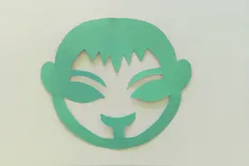 幼儿园手工，简单剪纸教程，用一张纸剪出一个小男孩的头像图片