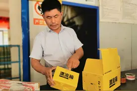 包装“减负” 胶带“瘦身” 快递包装“绿”起来图片