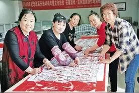 奋斗百年路 | 一把小剪刀“讲”出党的百年历史安塞民间艺术家创作百米剪纸作品为建党百年献礼图片