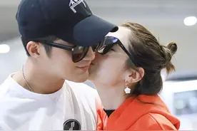 姜潮与爱妻麦迪娜现身，机场搂肩牵手亲吻，狂撒狗粮惹得满屏酸图片