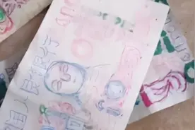 流浪汉拿手绘版“人民币”买面条，店主不怒反乐、照单全收：“他画得还挺有意思”图片