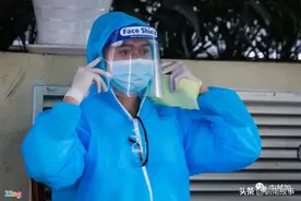 部分越南人开始主动戴防护帽 为了彼此的健康图片
