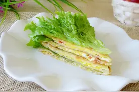 西红柿炒鸡蛋吃腻了，那就学做西红柿鸡蛋早餐饼吧，鲜嫩味美图片