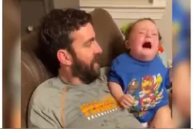 唐氏小男孩温柔亲吻妹妹，爸爸抱走妹妹的瞬间，哥哥反应暖心图片