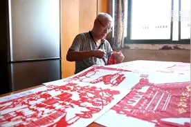 向祖国70周年华诞献礼  77岁老人“剪”出中国红视频封面