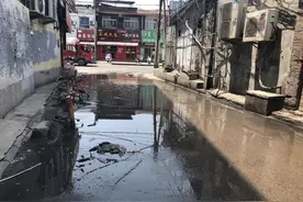 济南一小区门前马路逢雨就淹，市民急盼根治图片