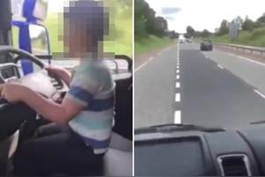 英国一卡车司机视频晒小男孩驾驶卡车在高速上行驶图