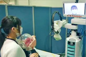 日本川崎重工研发新冠核酸检测机器人系统，我大使参观图片