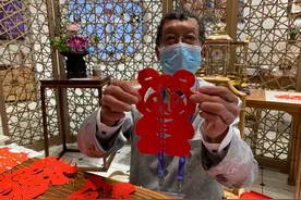 一分钟变出“进宝”！古朴撕纸非遗惊艳进博会图片