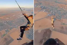 美国加州一名冒险者从1200米高热气球上荡秋千后跳伞图片