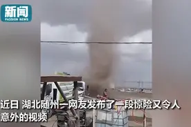 洗车大爷持水枪浇灭龙卷风，一通狂喷超淡定！网友：龙卷风不要面子吗？图片