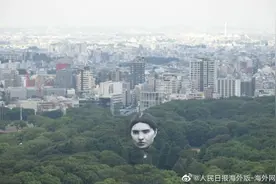 日本东京上空浮现神秘大脸：足有6层楼高 引发路人惊呼图片