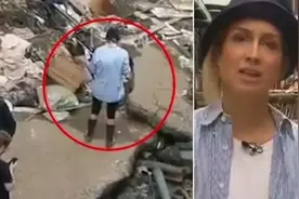 德国记者出镜前故意往身上抹泥，假装参与洪灾清理工作图片