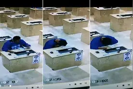 广西两男子在科目三考试时作弊被抓图片