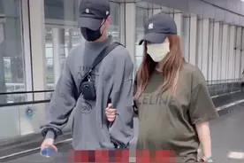 麦迪娜挺8个月大孕肚现身机场，紧挽姜潮手臂，手拎十几万包抢镜图片