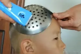 爸爸用“神器”给儿子剪头发，看到成果后，孩子表情瞬间成亮点图片