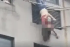 醉酒女子倒挂8楼晾衣架 邻居徒手攀墙将其拽住图片