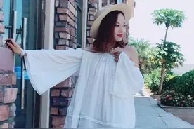 街拍：图六美女穿米色紧身衣搭配超短裤，身材丰满迷人韵味十足图片