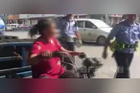 南昌一无证女司机路边耍泼 交警“公主抱”送上警车图片