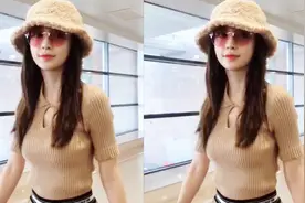 杨颖机场身穿毛衣戴毛绒帽，跟粉丝们吐槽：太热了，感觉穿错衣服