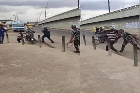 尼日尼亚警察看中男子的摩托车，光天化日直接硬抢，还拿AK威胁！视频封面