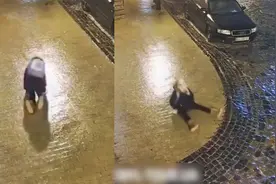 太难了！乌克兰路面结冰，女子连滚带爬还是没能过马路视频封面