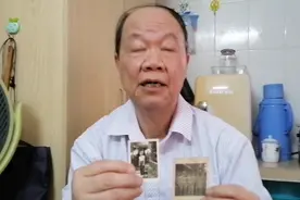 援越抗美高级翻译谭国泰手持佟义夫、谢杨芬照片@新华社视频封面