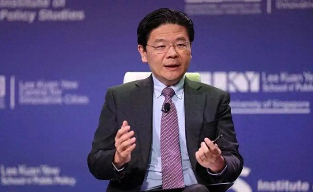 新加坡总理公开支持高市后，被罚18亿账单的金龙鱼	，凉得更快了