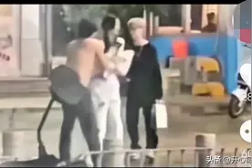不可思议！小伙女朋友被流浪汉骚扰，小伙不知道咋办，在一旁观望图片