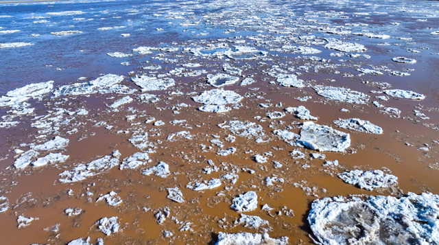 冬日奇观！落日流凌为黄河披上幻彩霓裳