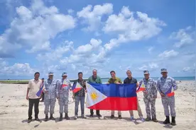 菲防长偷摸窜访中业岛，要在岛上盖“产房”，身后已被中方包围图片