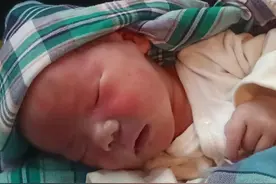 广安市寻亲：初生男婴被救助，穿米白色连体衣图片