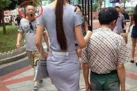 老婆穿得如此漂亮，旁边的丈夫却如此低调，路人都看得目瞪口呆图片