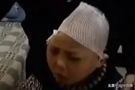 10年山东女子看电视，恰巧看到失踪的丈夫和儿子，儿子只剩半个头图片