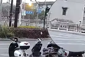 浙江湖州 一女子站在大桥外侧情绪激动欲跳桥轻生，路过的消防员飞奔上前一把拽住图片