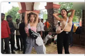韩国女网红太拼！穿低胸装在印度街头性感热舞，被当地人围观打量图片