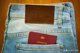 移民局回应：什么情况下才会“剪角”证件？图片