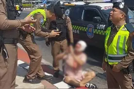 中国男子吸毒后在泰国芭提雅当街自残！图片