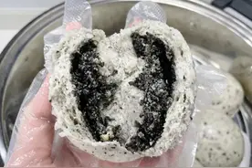 养生黑芝麻流心包把黑芝麻糊装进包子里图片