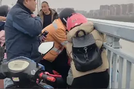 3月13日，南京发生2起突发事件：一男子欲跳江，一男子金鹰跳楼图片