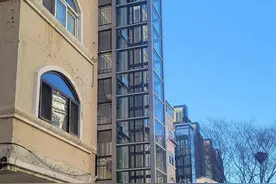 大连在长春花园试点老楼电梯“连片加装”图片