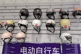 新标准实施后，骑电动车戴旧头盔会被罚吗？海南交警回应图片