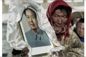 他老人家在人民的心中是永远的神。据说很多藏民家中还挂着画像！图片