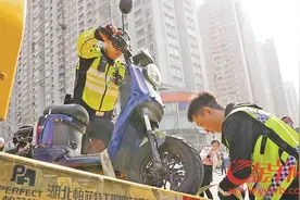 直击广州“电鸡”新规实施首日：无牌上路被扣车 未戴头盔被罚款图片